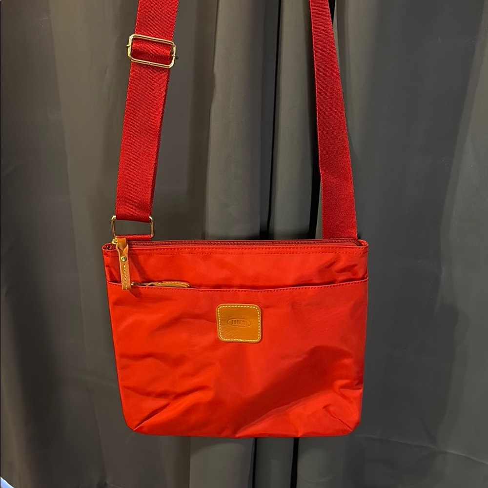 Bric's Red Crossbody Bag with Adjustable Strap and Minimalist Design